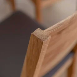 Esstischstuhl aus Wildeiche mit Kunstleder Sitz - Ernestan