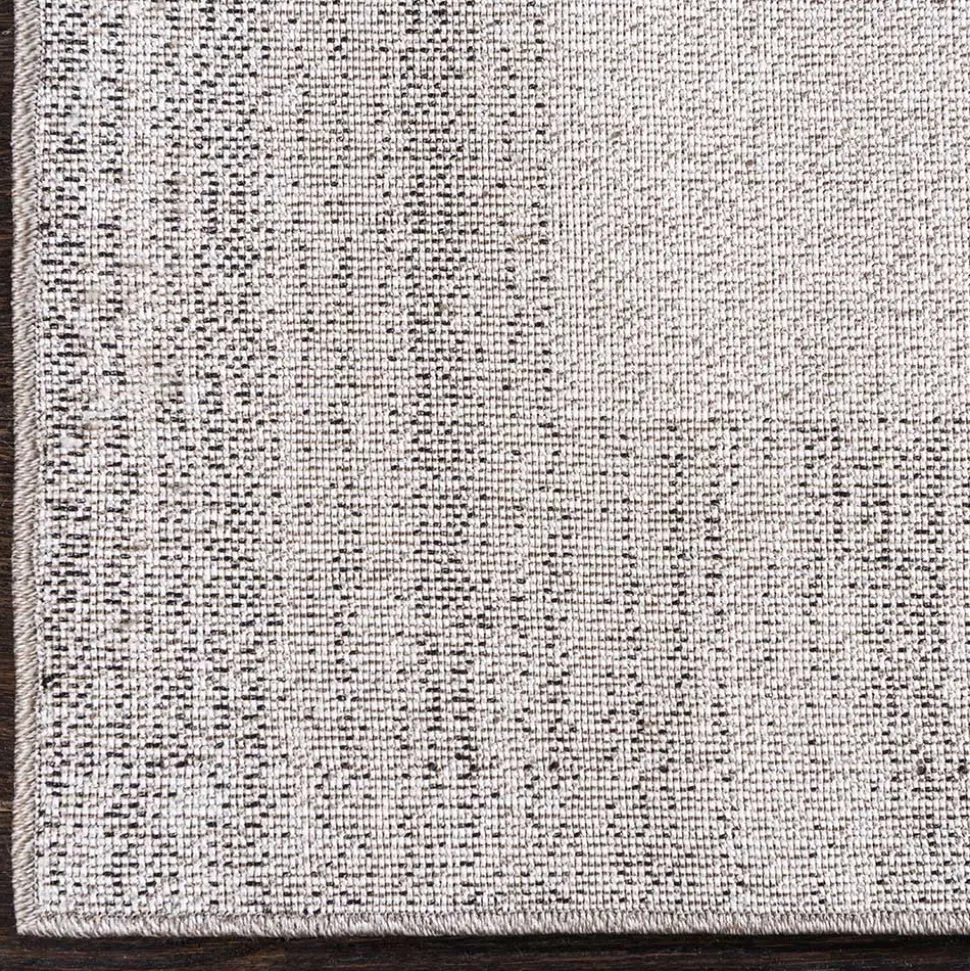 Teppich in Hellgrau mit dunkelgrauem Rand - Armina